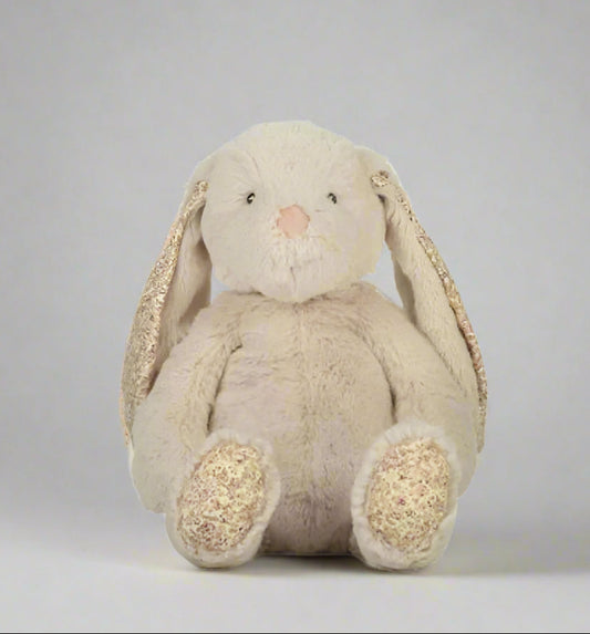 Plush bunny toy with pink accents on a gray background