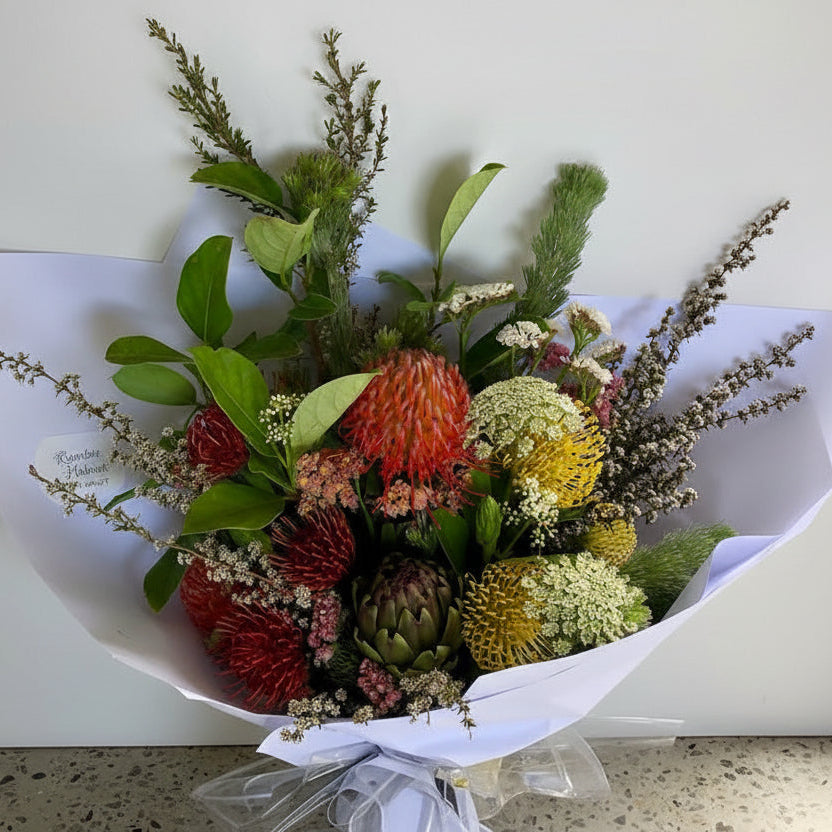 Bouquet of flowers with greenery on a white background