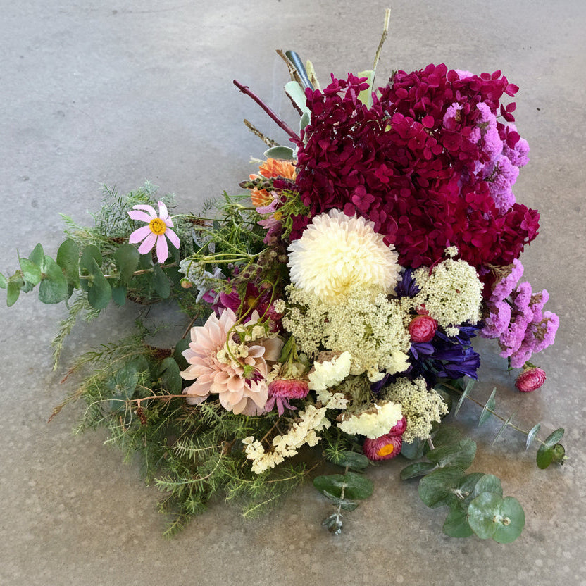 Bouquet of flowers with a mix of colors on a concrete surface
