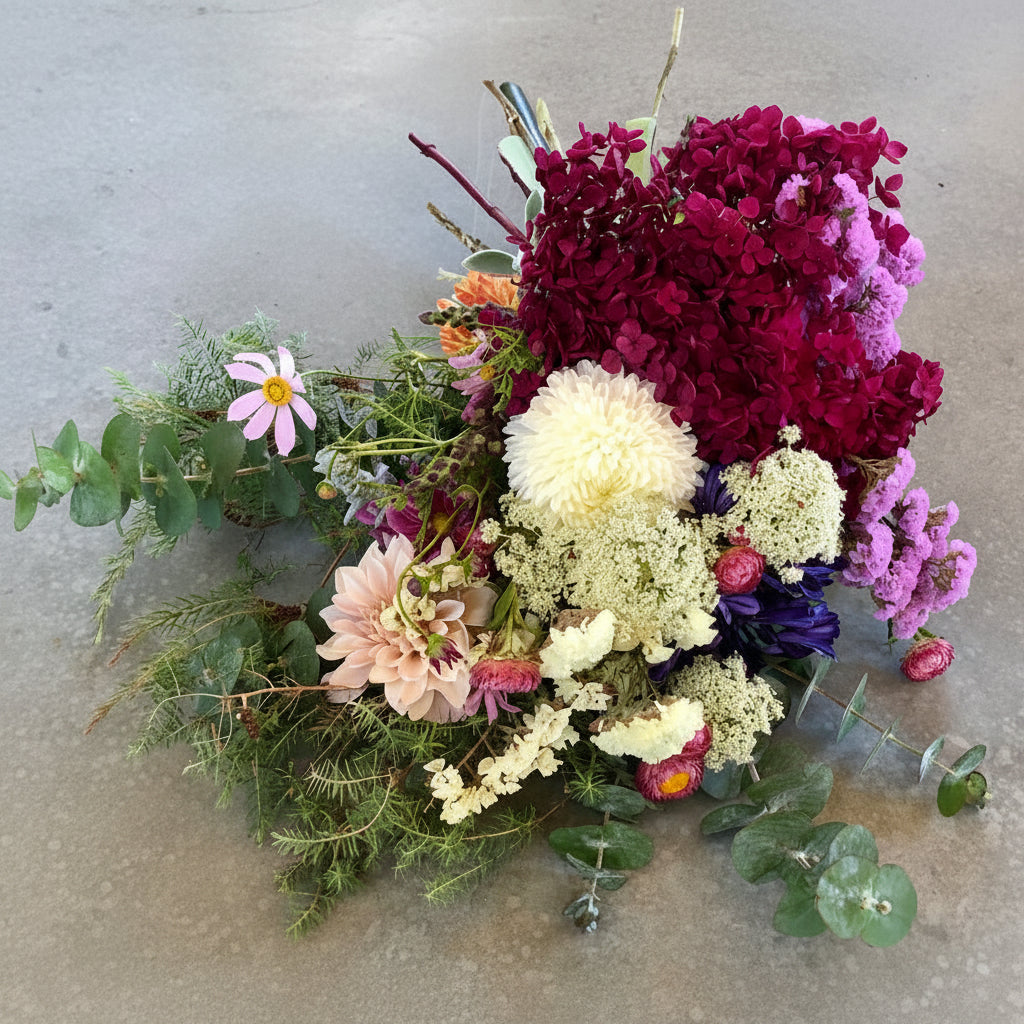Bouquet of flowers with a mix of colors on a concrete surface