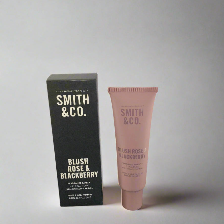 Smith & Co. blush rose & blackberry product on a black surface with a white background