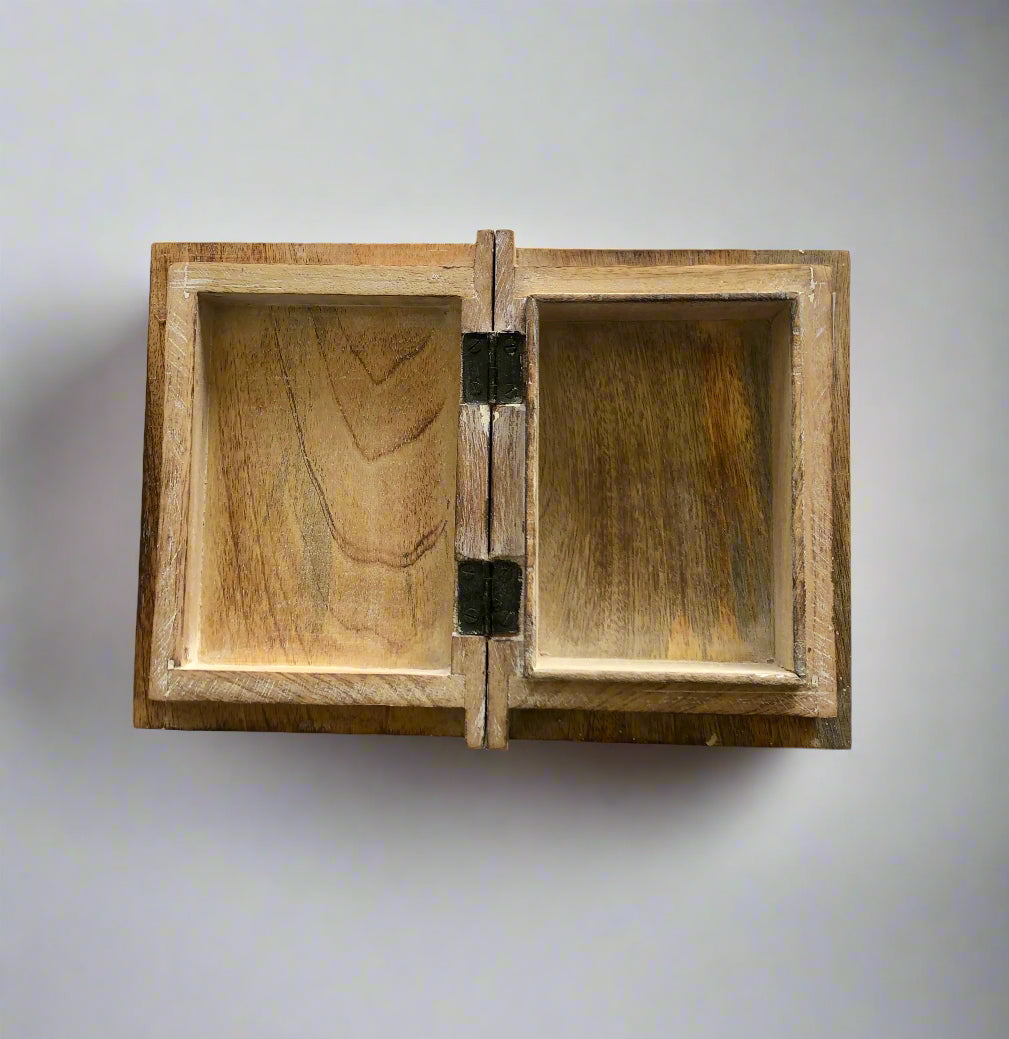 Wooden jewelry box with a hinged lid on a white background