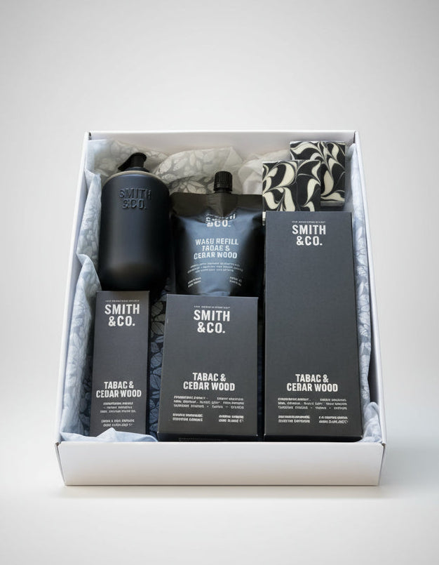 Smith & Co. set with candles, diffuser, hand wash bottle and hand cream with 2 soaps in a hamper.