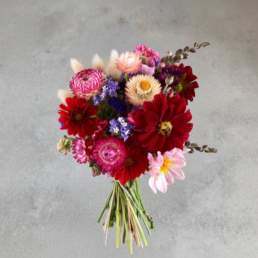 Bouquet of colorful flowers on a gray background