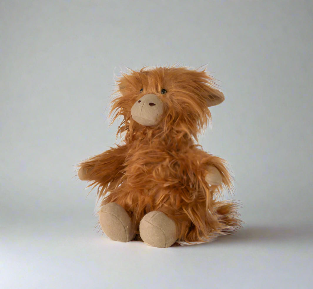 Brown plush toy on a white background