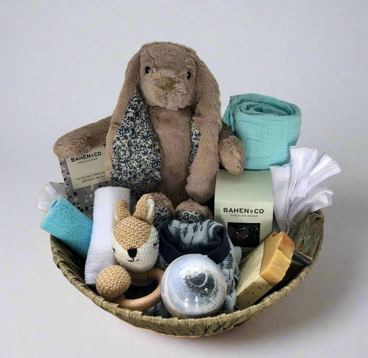 baby gift set with plush toys, soap, bath bomb, chocolate, baby singlets and baby bib, wash cloths.