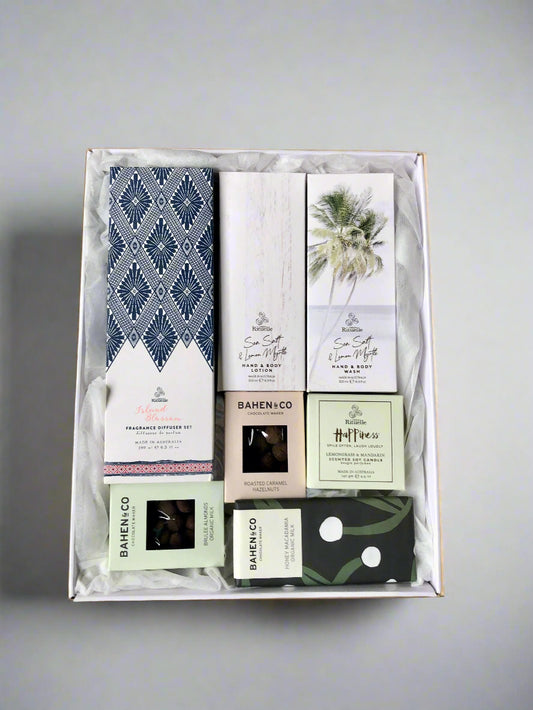 Box of bath and body products and chocolates