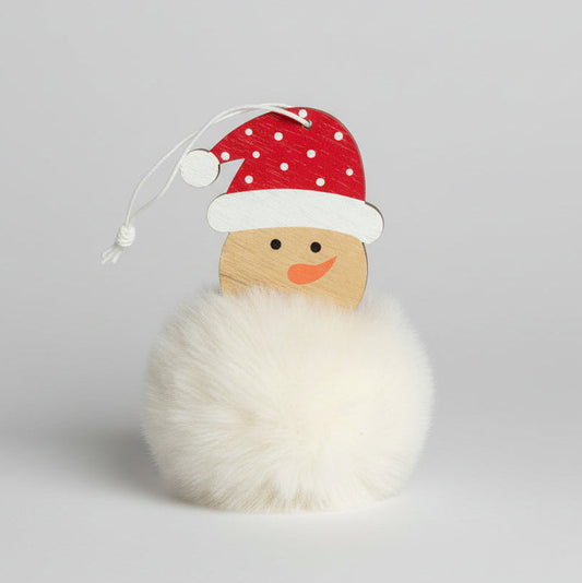 Decorative wooden figure with a red Santa hat on a light gray background