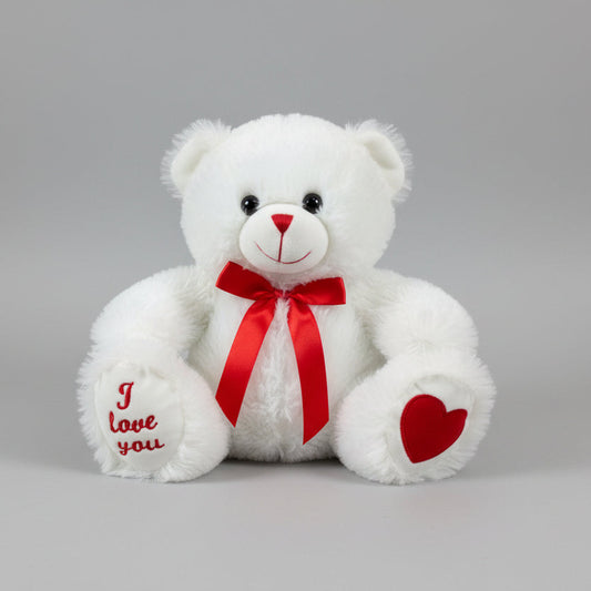 White teddy bear with a red bow and heart on a gray background