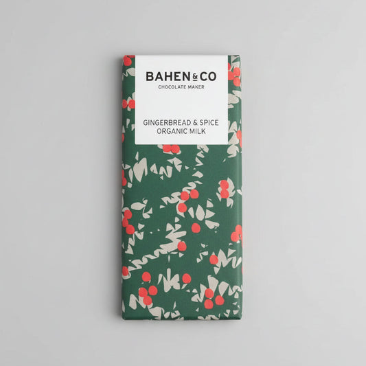 Bahlen & Co gingerbread & spice organic milk chocolate bar on a dark textured surface